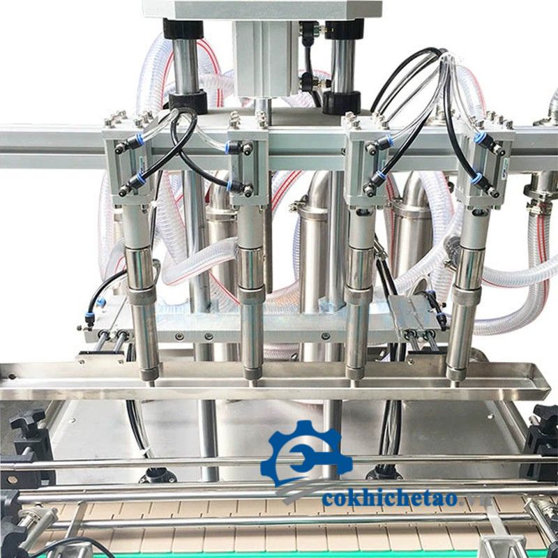 Máy chiết rót 4 vòi tự động có băng tải